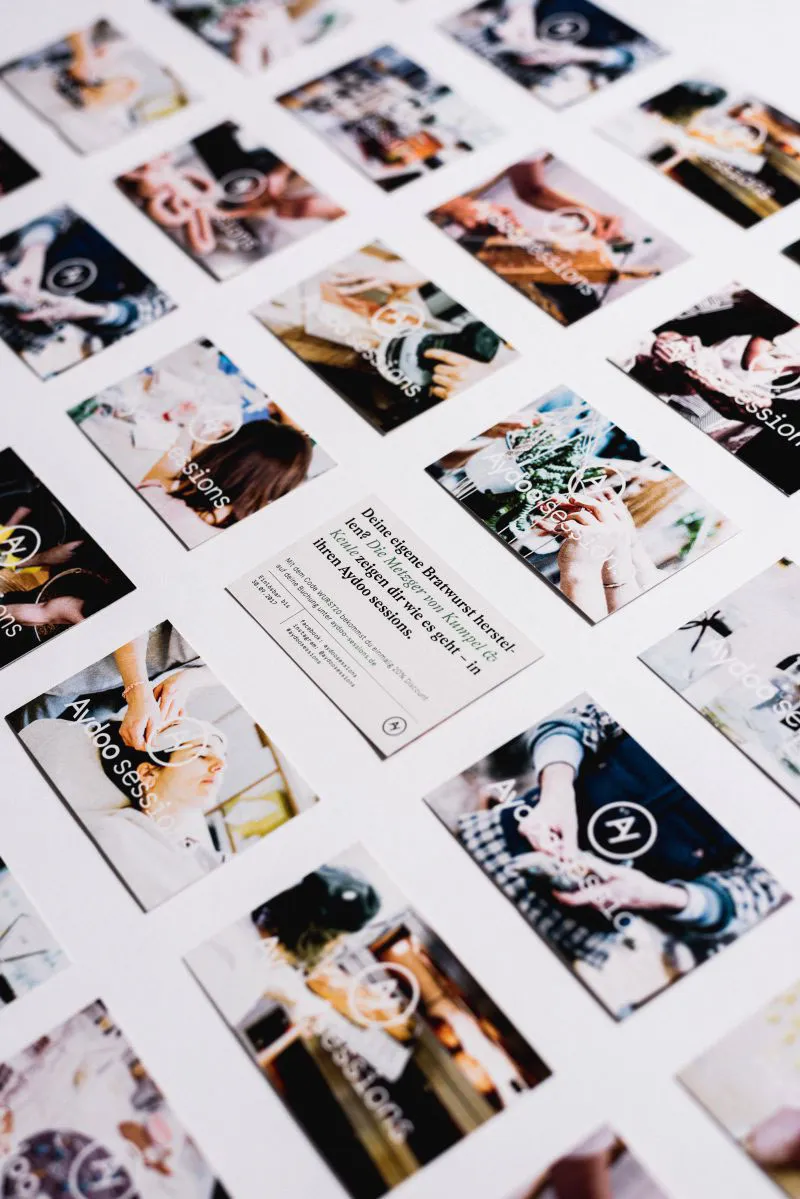 A slection of flyiers in size of busiess cards with photos from various workshops.