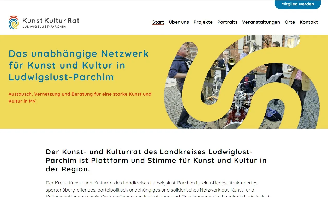 Screenshot of the home page, the header has bold colors a photo of musicians.