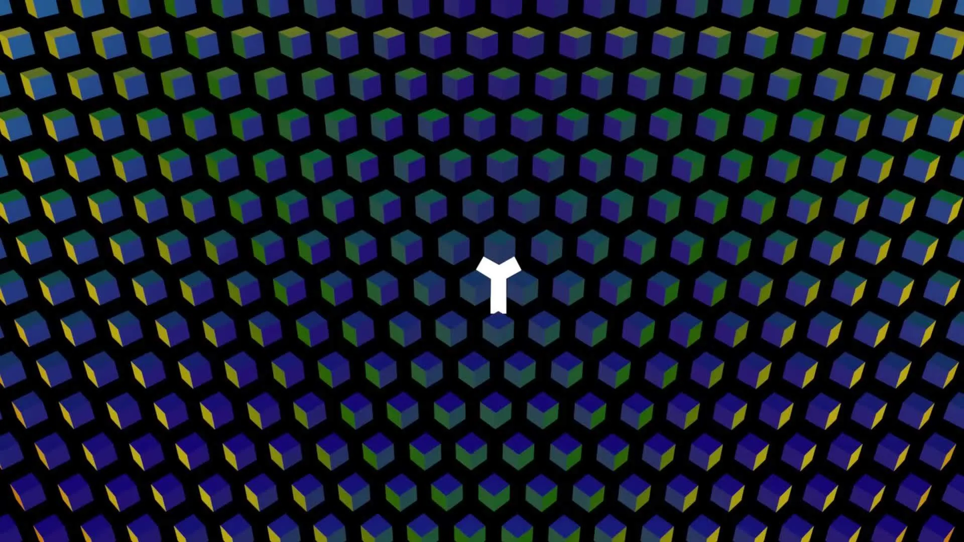 The letter T gets revealed in the white space between colorful cubes.